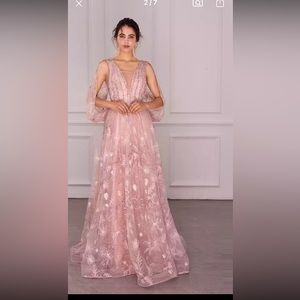 Beautiful pink beaded special occasions dress. Never been worn.